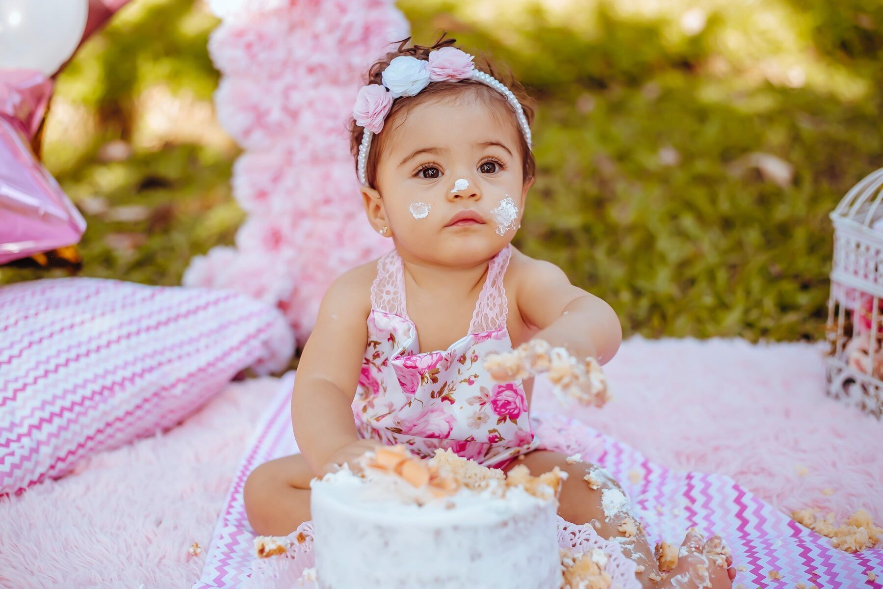 Little girl with cake on her face.