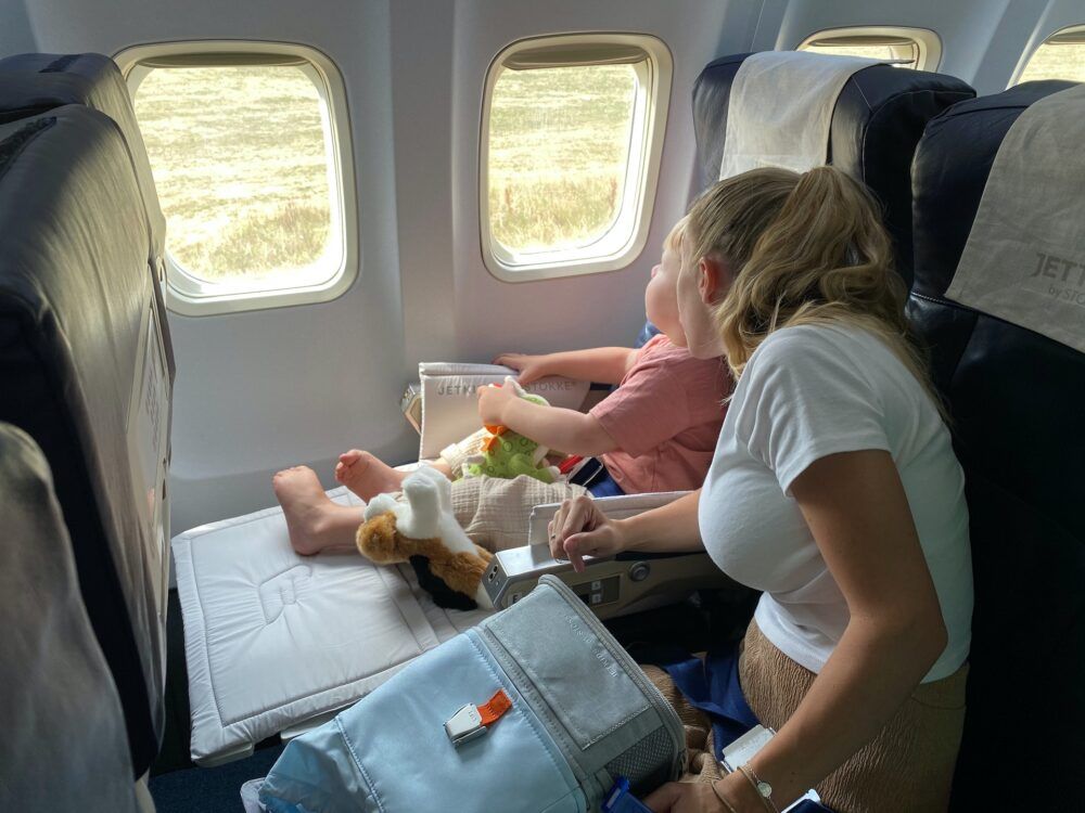 Mum and baby in plane.