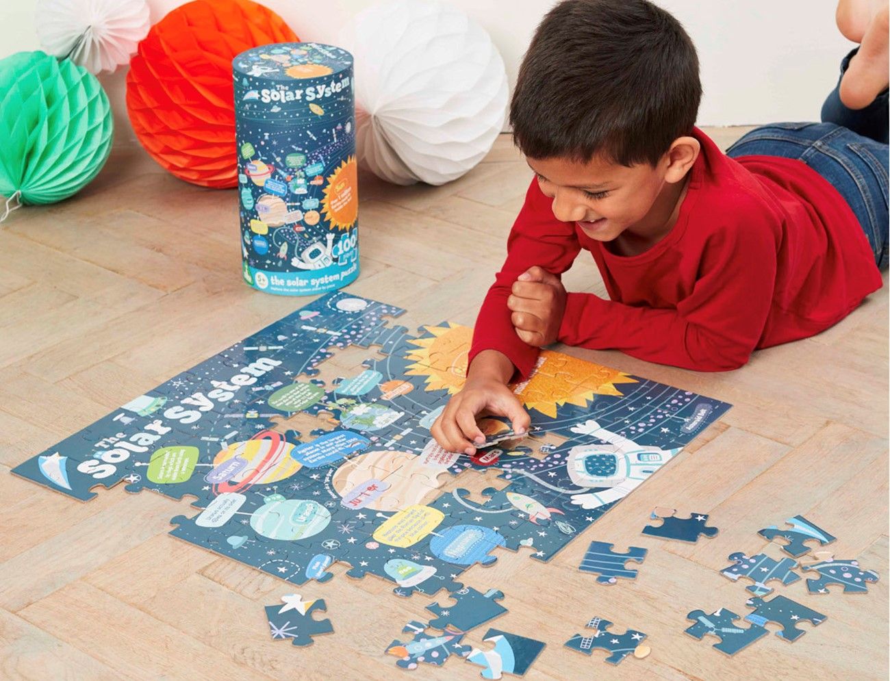 Boy plays with puzzle.
