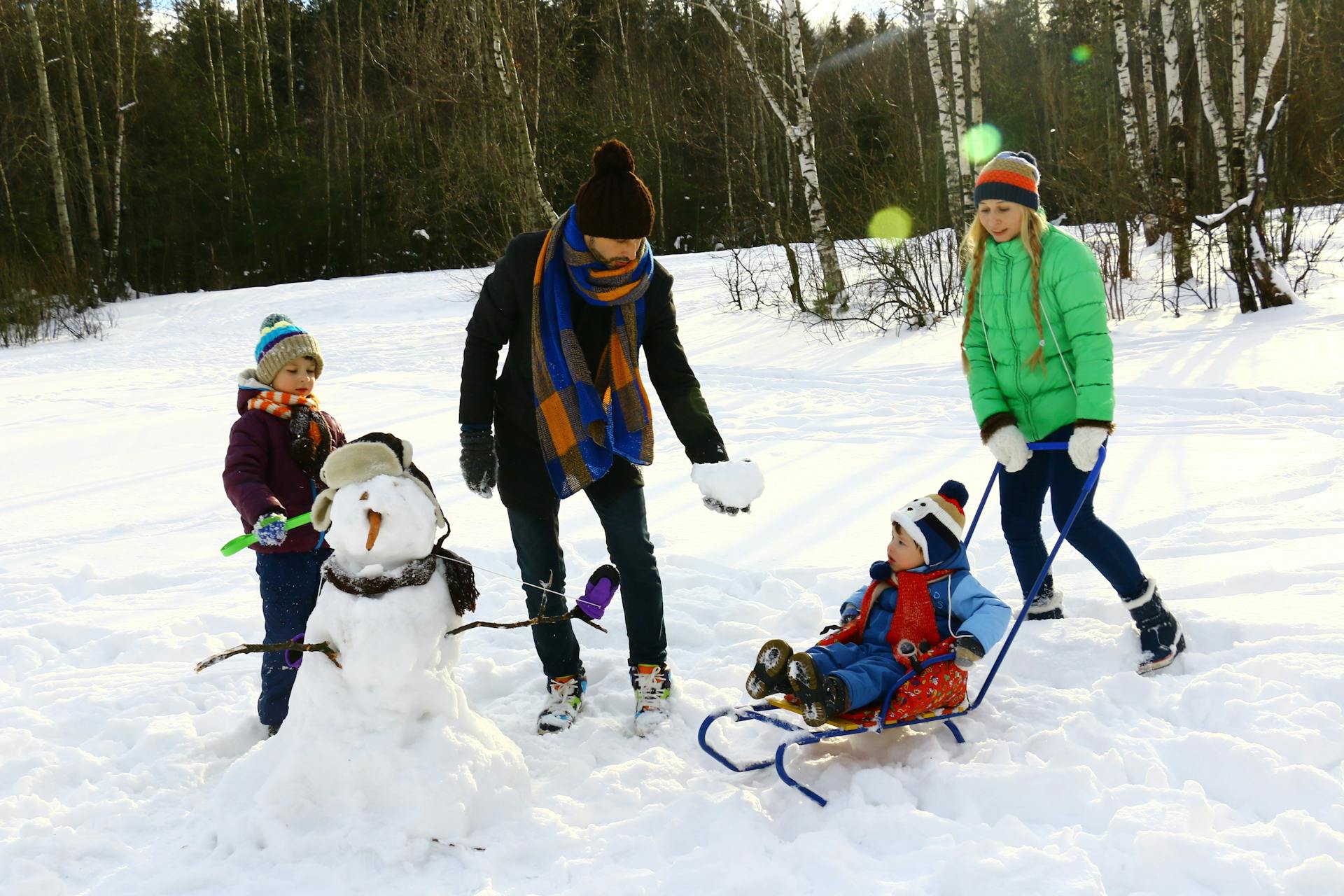 A family playing in the snow.